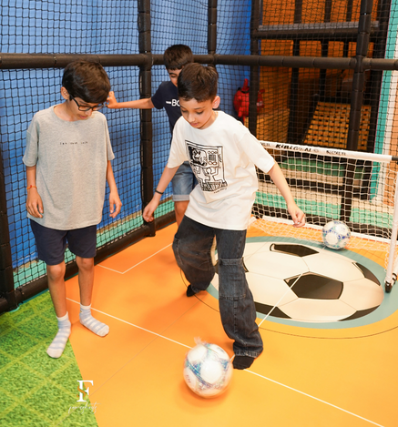Children playing football at the Wooray Elite Ludhiana Football Arena