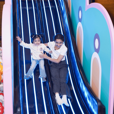 Children enjoying a slide at Wooray Elite Ludhiana