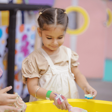 Child enjoying a creative activity at Wooray Elite Ludhiana