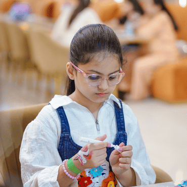Child enjoying a creative art and craft activity at Wooray Ludhiana