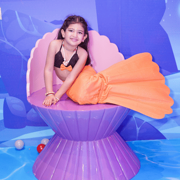 Girl dressed as a mermaid enjoying a themed play experience at Wooray Ludhiana