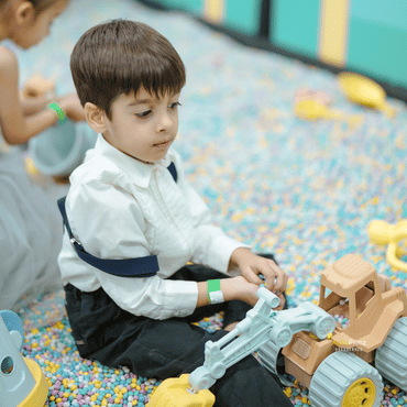 Young boy playing with construction toys at Wooray Ludhiana kids play area